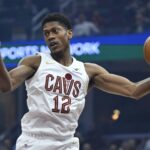 Dec 3, 2025; Cleveland, Ohio, USA; Cleveland Cavaliers forward De'Andre Hunter (12) rebounds in the first quarter against the Portland Trail Blazers at Rocket Arena. Mandatory Credit: David Richard-Imagn Images