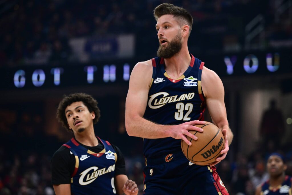 Nov 30, 2025; Cleveland, Ohio, USA; Cleveland Cavaliers forward Dean Wade (32) grabs a rebound during the first half against the Boston Celtics at Rocket Arena. Mandatory Credit: David Dermer-Imagn Images