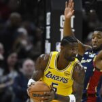 Cleveland Cavaliers guard Donovan Mitchell (45) defends Los Angeles Lakers center Deandre Ayton (5) in the fourth quarter at Rocket Arena.
