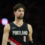 Portland Trail Blazers forward Deni Avdija (8) walks on the court during a break in the action during the second half against the Dallas Mavericks at Moda Center.