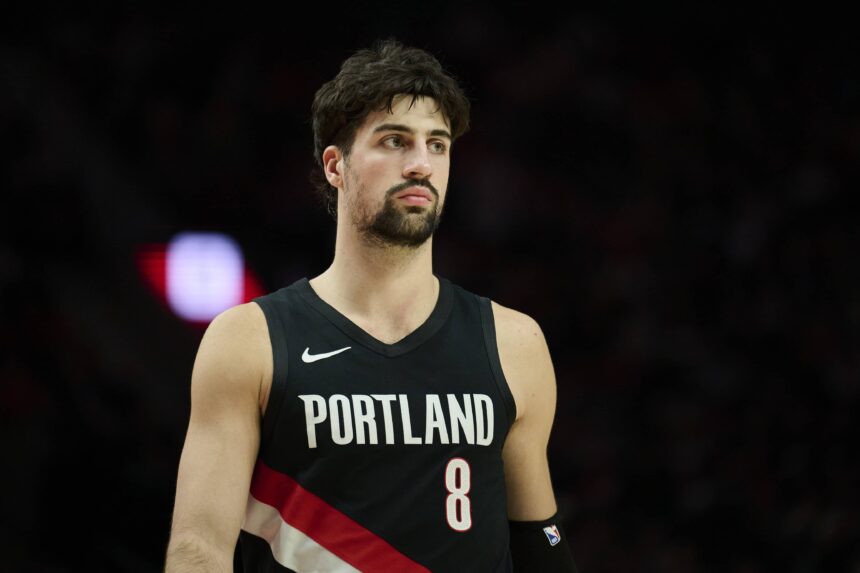 Portland Trail Blazers forward Deni Avdija (8) walks on the court during a break in the action during the second half against the Dallas Mavericks at Moda Center.