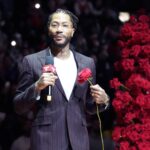 Chicago Bulls and New York Knicks former player Derrick Rose speaks as he is honored at halftime of a game between the Chicago Bulls and the New York Knicks at United Center.