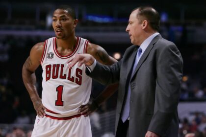 Chicago Bulls point guard Derrick Rose (1) talks with head coach Tom Thibodeau during the first quarter of a preseason game against the Toronto Raptors at the United Center.