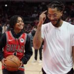 Jan 4, 2025; Chicago, Illinois, USA; Chicago Bulls and New York Knicks former player Derrick Rose shoots baskets with his son PJ. Rose before a game between the Chicago Bulls and the New York Knicks at United Center. Rose will be honored at halftime of the game. Mandatory Credit: David Banks-Imagn Images
