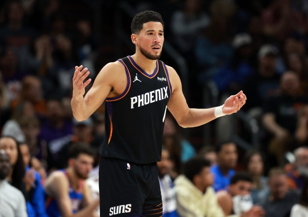 Jan 4, 2026; Phoenix, Arizona, USA; Phoenix Suns guard Devin Booker (1) reacts against the Oklahoma City Thunder in the first half at Mortgage Matchup Center. Mandatory Credit: Mark J. Rebilas-Imagn Images