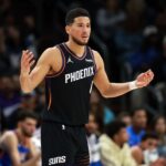 Jan 4, 2026; Phoenix, Arizona, USA; Phoenix Suns guard Devin Booker (1) reacts against the Oklahoma City Thunder in the first half at Mortgage Matchup Center. Mandatory Credit: Mark J. Rebilas-Imagn Images