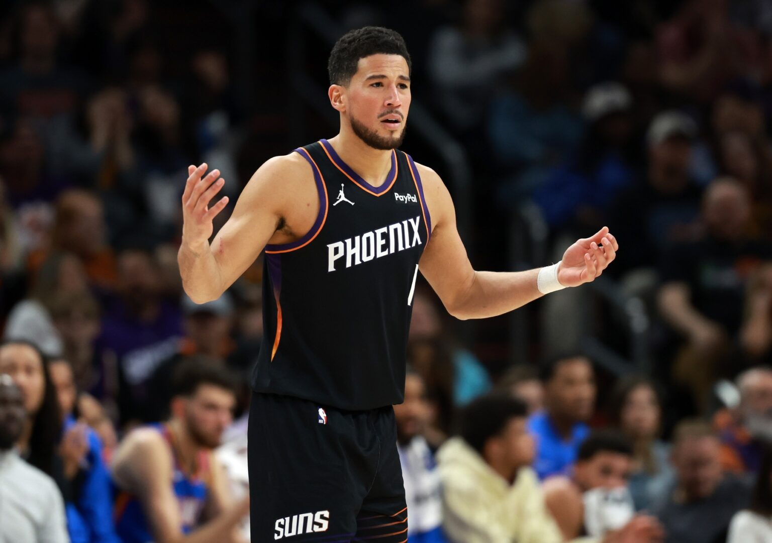Jan 4, 2026; Phoenix, Arizona, USA; Phoenix Suns guard Devin Booker (1) reacts against the Oklahoma City Thunder in the first half at Mortgage Matchup Center. Mandatory Credit: Mark J. Rebilas-Imagn Images