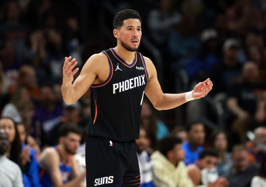 Jan 4, 2026; Phoenix, Arizona, USA; Phoenix Suns guard Devin Booker (1) reacts against the Oklahoma City Thunder in the first half at Mortgage Matchup Center. Mandatory Credit: Mark J. Rebilas-Imagn Images
