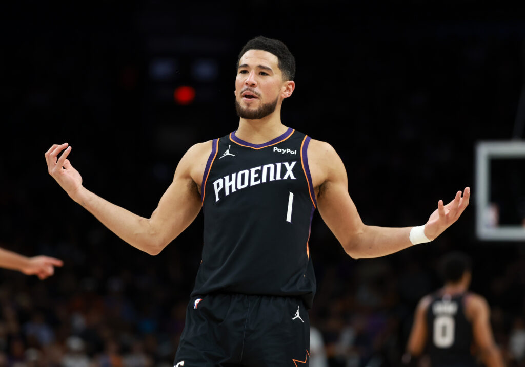 Jan 4, 2026; Phoenix, Arizona, USA; Phoenix Suns guard Devin Booker (1) reacts against the Oklahoma City Thunder in the first half at Mortgage Matchup Center. Mandatory Credit: Mark J. Rebilas-Imagn Images