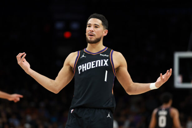 Jan 4, 2026; Phoenix, Arizona, USA; Phoenix Suns guard Devin Booker (1) reacts against the Oklahoma City Thunder in the first half at Mortgage Matchup Center. Mandatory Credit: Mark J. Rebilas-Imagn Images