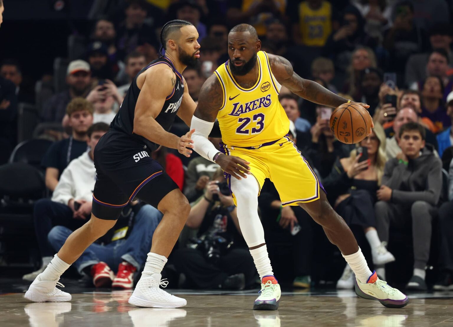 Dec 23, 2025; Phoenix, Arizona, USA; Los Angeles Lakers forward LeBron James (23) against Phoenix Suns forward Dillon Brooks (3) at Mortgage Matchup Center. Mandatory Credit: Mark J. Rebilas-Imagn Images