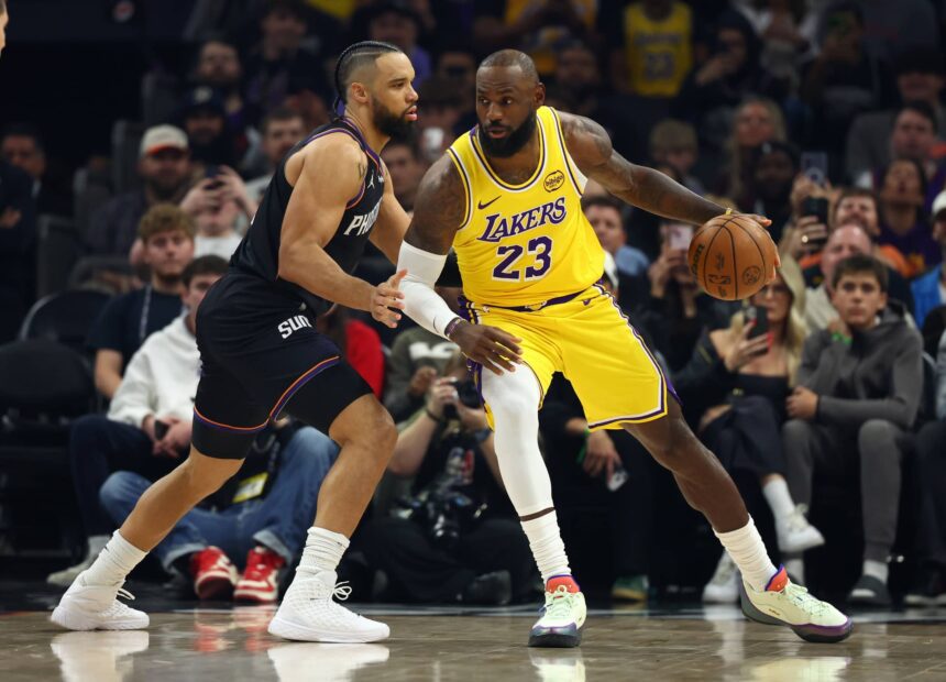Dec 23, 2025; Phoenix, Arizona, USA; Los Angeles Lakers forward LeBron James (23) against Phoenix Suns forward Dillon Brooks (3) at Mortgage Matchup Center. Mandatory Credit: Mark J. Rebilas-Imagn Images