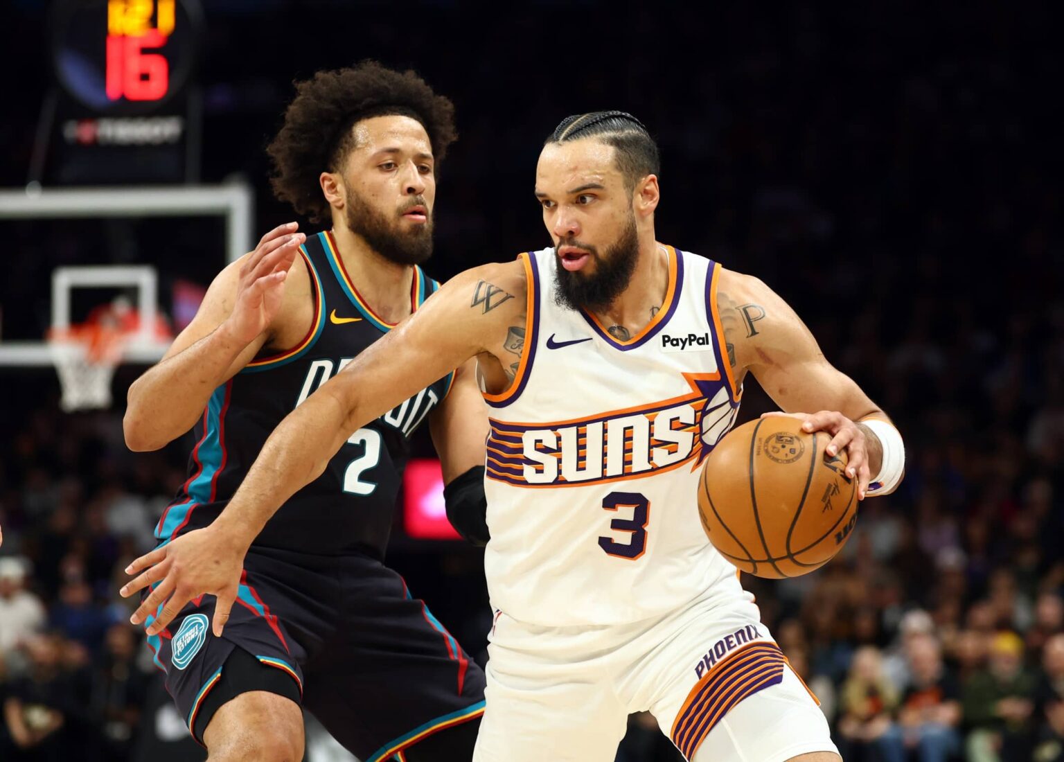 Jan 29, 2026; Phoenix, Arizona, USA; Detroit Pistons guard Cade Cunningham (2) defends against Phoenix Suns forward Dillon Brooks (3) in the first half at Mortgage Matchup Center. Mandatory Credit: Mark J. Rebilas-Imagn Images