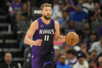 Apr 11, 2025; Sacramento, California, USA; Sacramento Kings forward Domantas Sabonis (11) dribbles against the Los Angeles Clippers during the second quarter at Golden 1 Center. Mandatory Credit: Darren Yamashita-Imagn Images