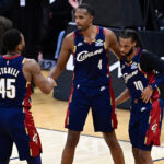 Jan 2, 2026; Cleveland, Ohio, USA; Cleveland Cavaliers center Evan Mobley (4) congratulates guard Donovan Mitchell (45) and guard Darius Garland (10) after the Cavaliers defeated the Denver Nuggets at Rocket Arena. Mandatory Credit: David Dermer-Imagn Images