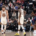 Jan 5, 2026; Inglewood, California, USA; Golden State Warriors guard Stephen Curry (30) and forward Draymond Green (23) react against the LA Clippers in the second half at Intuit Dome. Mandatory Credit: Kirby Lee-Imagn Images