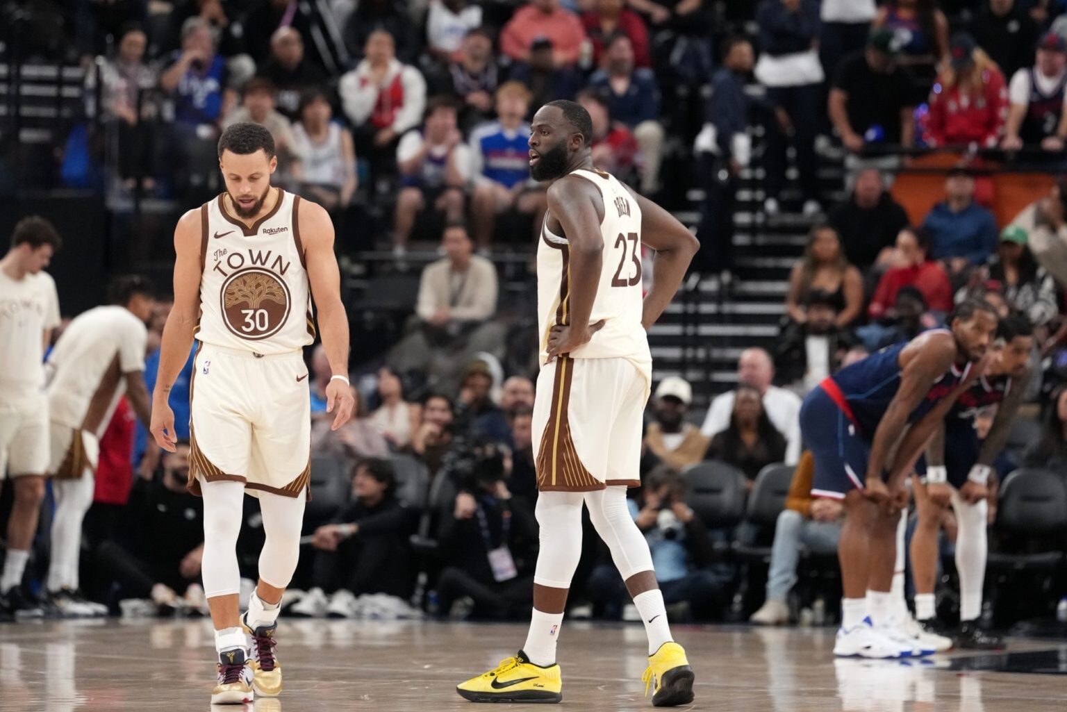 Jan 5, 2026; Inglewood, California, USA; Golden State Warriors guard Stephen Curry (30) and forward Draymond Green (23) react against the LA Clippers in the second half at Intuit Dome. Mandatory Credit: Kirby Lee-Imagn Images
