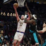 Jan 17, 2026; Portland, Oregon, USA; Los Angeles Lakers forward Drew Timme (17) drives to the basket during the second half against Portland Trail Blazers center Duop Reath (26) at Moda Center. Mandatory Credit: Troy Wayrynen-Imagn Images