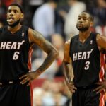 Miami Heat small forward LeBron James (6) and shooting guard Dwyane Wade (3) look on as time winds down in the fourth quarter against the Portland Trail Blazers at the Rose Garden. Heat won the game 107-93.