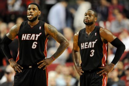 Miami Heat small forward LeBron James (6) and shooting guard Dwyane Wade (3) look on as time winds down in the fourth quarter against the Portland Trail Blazers at the Rose Garden. Heat won the game 107-93.