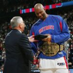 NOVEMBER 2: Elden Campbell #41 of the Detroit Pistons gets congratulated by NBA Commissioner David Stern during the championship ring ceremony prior to facing the Houston Rockets on November 2, 2004 at the Palace at Auburn Hills in Detroit, Michigan. Photo by Jesse D. Garrabrant/NBAE via Getty Images
