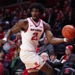 Rutgers Scarlet Knights center Emmanuel Ogbole (21) looks to pass the ball during the first half against the Penn Quakers at Jersey Mike's Arena.