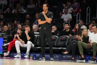 Jan 4, 2026; Miami, Florida, USA; Miami Heat head coach Erik Spoelstra keeps his eyes on his team during the first half at Kaseya Center against the New Orleans Pelicans. Mandatory Credit: Jim Rassol-Imagn Images