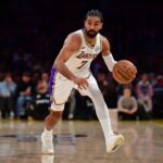 Los Angeles Lakers guard Gabe Vincent (7) controls the ball against the Toronto Raptors during the first half at Crypto.com Arena.