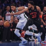 Nov 28, 2025; New York, New York, USA; Milwaukee Bucks forward Giannis Antetokounmpo (34) and New York Knicks center Karl-Anthony Towns (32) battle for the ball during the first half at Madison Square Garden. Mandatory Credit: Vincent Carchietta-Imagn Images