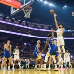 Jan 7, 2026; San Francisco, California, USA; Milwaukee Bucks forward Giannis Antetokounmpo (34) shoots the ball against Golden State Warriors guard Stephen Curry (30), guard Moses Moody (4) and forward Draymond Green (23) during the first quarter at Chase Center. Mandatory Credit: Robert Edwards-Imagn Images