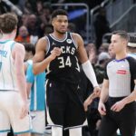 Milwaukee Bucks forward Giannis Antetokounmpo (34) celebrates a 122-121 win over the Charlotte Hornets at Fiserv Forum.
