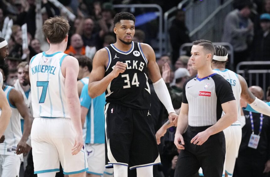 Milwaukee Bucks forward Giannis Antetokounmpo (34) celebrates a 122-121 win over the Charlotte Hornets at Fiserv Forum.