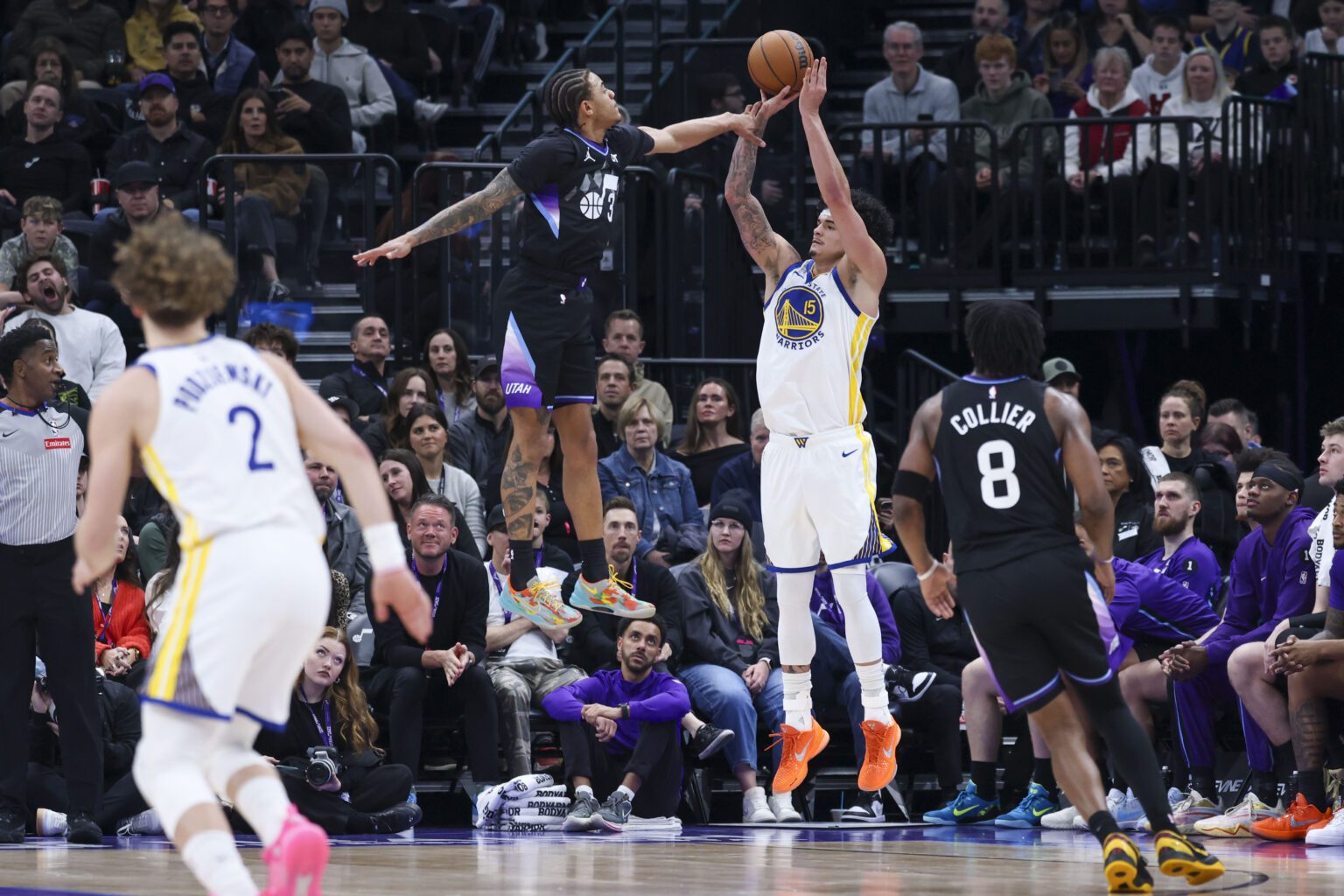 Jan 28, 2026; Salt Lake City, Utah, USA; Golden State Warriors forward Gui Santos (15) goes up for a shot against Utah Jazz guard Keyonte George (3) during the first half at Delta Center. Mandatory Credit: Rob Gray-Imagn Images