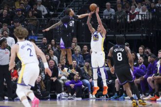 Jan 28, 2026; Salt Lake City, Utah, USA; Golden State Warriors forward Gui Santos (15) goes up for a shot against Utah Jazz guard Keyonte George (3) during the first half at Delta Center. Mandatory Credit: Rob Gray-Imagn Images