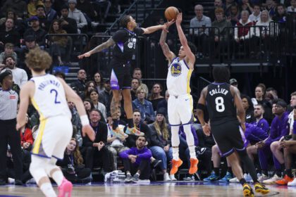 Jan 28, 2026; Salt Lake City, Utah, USA; Golden State Warriors forward Gui Santos (15) goes up for a shot against Utah Jazz guard Keyonte George (3) during the first half at Delta Center. Mandatory Credit: Rob Gray-Imagn Images