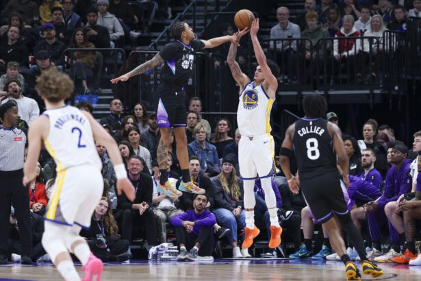 Jan 28, 2026; Salt Lake City, Utah, USA; Golden State Warriors forward Gui Santos (15) goes up for a shot against Utah Jazz guard Keyonte George (3) during the first half at Delta Center. Mandatory Credit: Rob Gray-Imagn Images