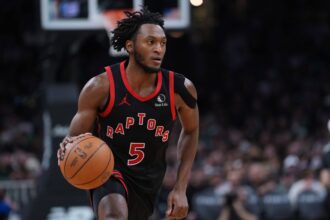 Jan 9, 2026; Boston, Massachusetts, USA; Toronto Raptors guard Immanuel Quickley (5) returns the ball against the Boston Celtics in the second half at TD Garden. Mandatory Credit: David Butler II-Imagn Images