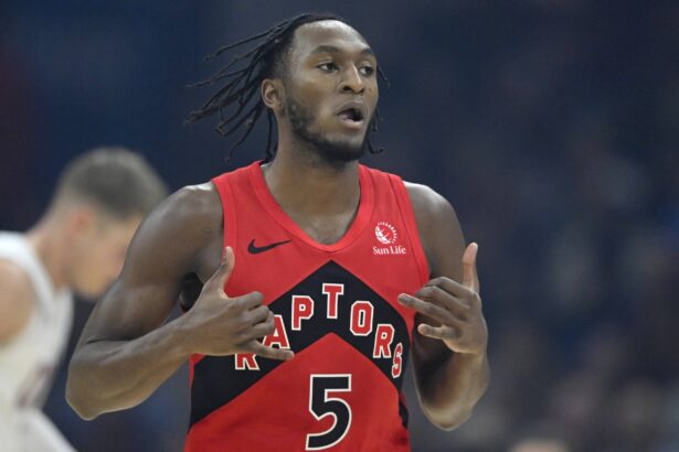 Nov 13, 2025; Cleveland, Ohio, USA; Toronto Raptors guard Immanuel Quickley (5) celebrates his three-point basket in the first quarter against the Cleveland Cavaliers at Rocket Arena. Mandatory Credit: David Richard-Imagn Images