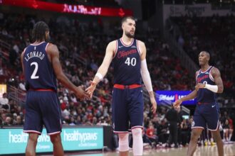 Dec 11, 2025; Houston, Texas, USA; Los Angeles Clippers center Ivica Zubac (40) shakes hands with forward Kawhi Leonard (2) after a play during the second quarter against the Houston Rockets at Toyota Center. Mandatory Credit: Troy Taormina-Imagn Images