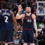 Jan 5, 2026; Inglewood, California, USA; LA Clippers center Ivica Zubac (40) celebrates with forward Kawhi Leonard (2) against the Golden State Warriors in the second half at Intuit Dome. Mandatory Credit: Kirby Lee-Imagn Images