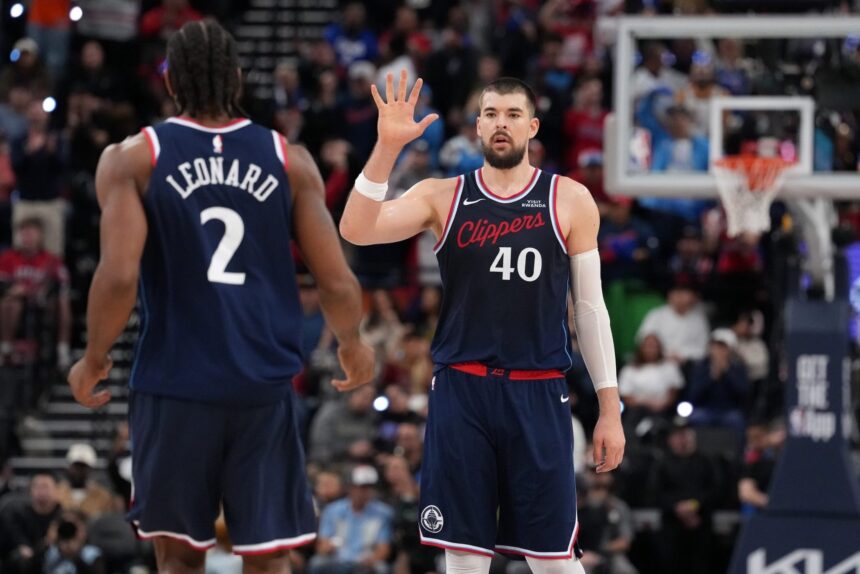 Jan 5, 2026; Inglewood, California, USA; LA Clippers center Ivica Zubac (40) celebrates with forward Kawhi Leonard (2) against the Golden State Warriors in the second half at Intuit Dome. Mandatory Credit: Kirby Lee-Imagn Images