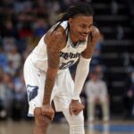 Dec 26, 2025; Memphis, Tennessee, USA; Memphis Grizzlies guard Ja Morant (12) reacts during the second quarter against the Milwaukee Bucks at FedExForum. Mandatory Credit: Petre Thomas-Imagn Images