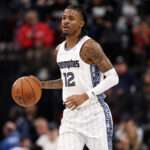 Dec 15, 2025; Inglewood, California, USA; Memphis Grizzlies guard Ja Morant (12) brings the ball up court during the third quarter against the Los Angeles Clippers at Intuit Dome. Mandatory Credit: Kiyoshi Mio-Imagn Images