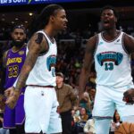 Mar 29, 2025; Memphis, Tennessee, USA; Memphis Grizzlies guard Ja Morant (12) and Memphis Grizzlies forward Jaren Jackson Jr. (13) react during the third quarter against the Los Angeles Lakers at FedExForum. Mandatory Credit: Petre Thomas-Imagn Images