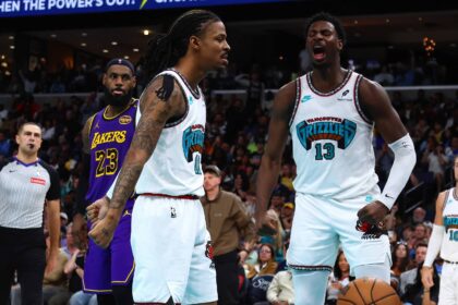 Mar 29, 2025; Memphis, Tennessee, USA; Memphis Grizzlies guard Ja Morant (12) and Memphis Grizzlies forward Jaren Jackson Jr. (13) react during the third quarter against the Los Angeles Lakers at FedExForum. Mandatory Credit: Petre Thomas-Imagn Images