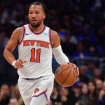 New York Knicks guard Jalen Brunson (11) moves the ball up court against the Los Angeles Clippers during the second half at Crypto.com Arena.