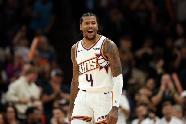 Nov 6, 2025; Phoenix, Arizona, USA; Phoenix Suns guard Jalen Green (4) celebrates against the Los Angeles Clippers at the Mortgage Matchup Center. Mandatory Credit: Mark J. Rebilas-Imagn Images