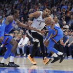Jan 13, 2026; Oklahoma City, Oklahoma, USA; San Antonio Spurs forward/center Victor Wembanyama (1) drives to the basket beside Oklahoma City Thunder guard/forward Jalen Williams (8) during the second quarter at Paycom Center. Mandatory Credit: Alonzo Adams-Imagn Images