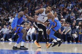 Jan 13, 2026; Oklahoma City, Oklahoma, USA; San Antonio Spurs forward/center Victor Wembanyama (1) drives to the basket beside Oklahoma City Thunder guard/forward Jalen Williams (8) during the second quarter at Paycom Center. Mandatory Credit: Alonzo Adams-Imagn Images