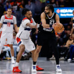 Jan 17, 2026; Denver, Colorado, USA; Denver Nuggets guard Jamal Murray (27) controls the ball as Washington Wizards guard Bub Carrington (7) guards in the fourth quarter at Ball Arena. Mandatory Credit: Isaiah J. Downing-Imagn Images